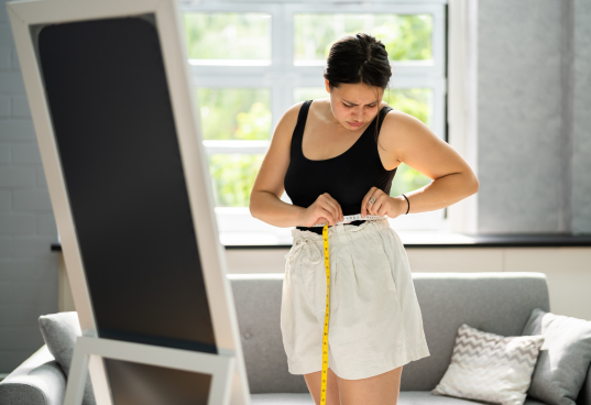A confident, healthy person after a successful weight loss program